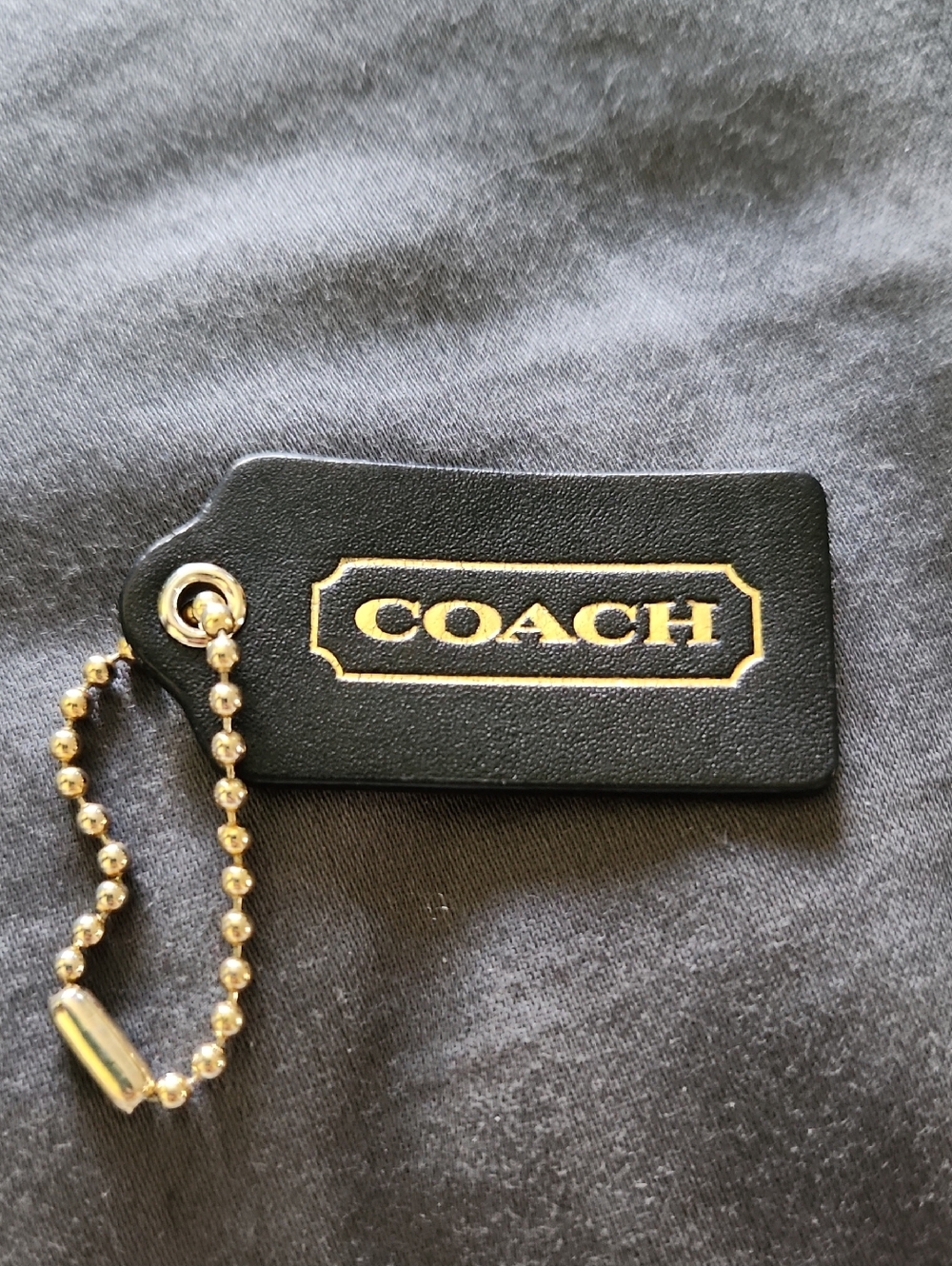Coach Black Leather Tag with Gold Logo and Chain